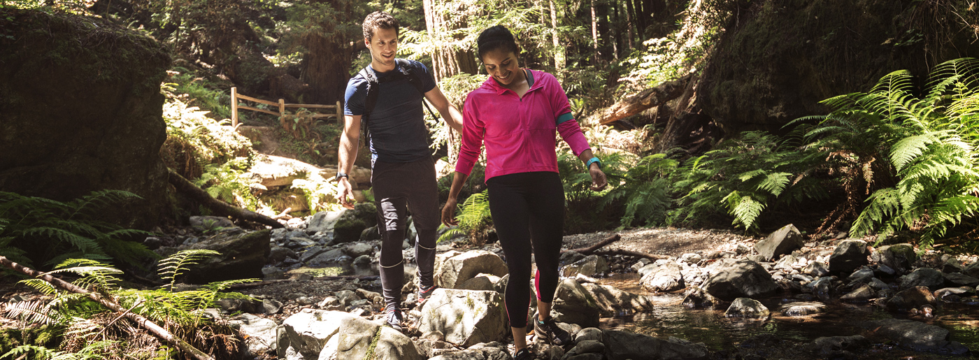 couple walking in woods